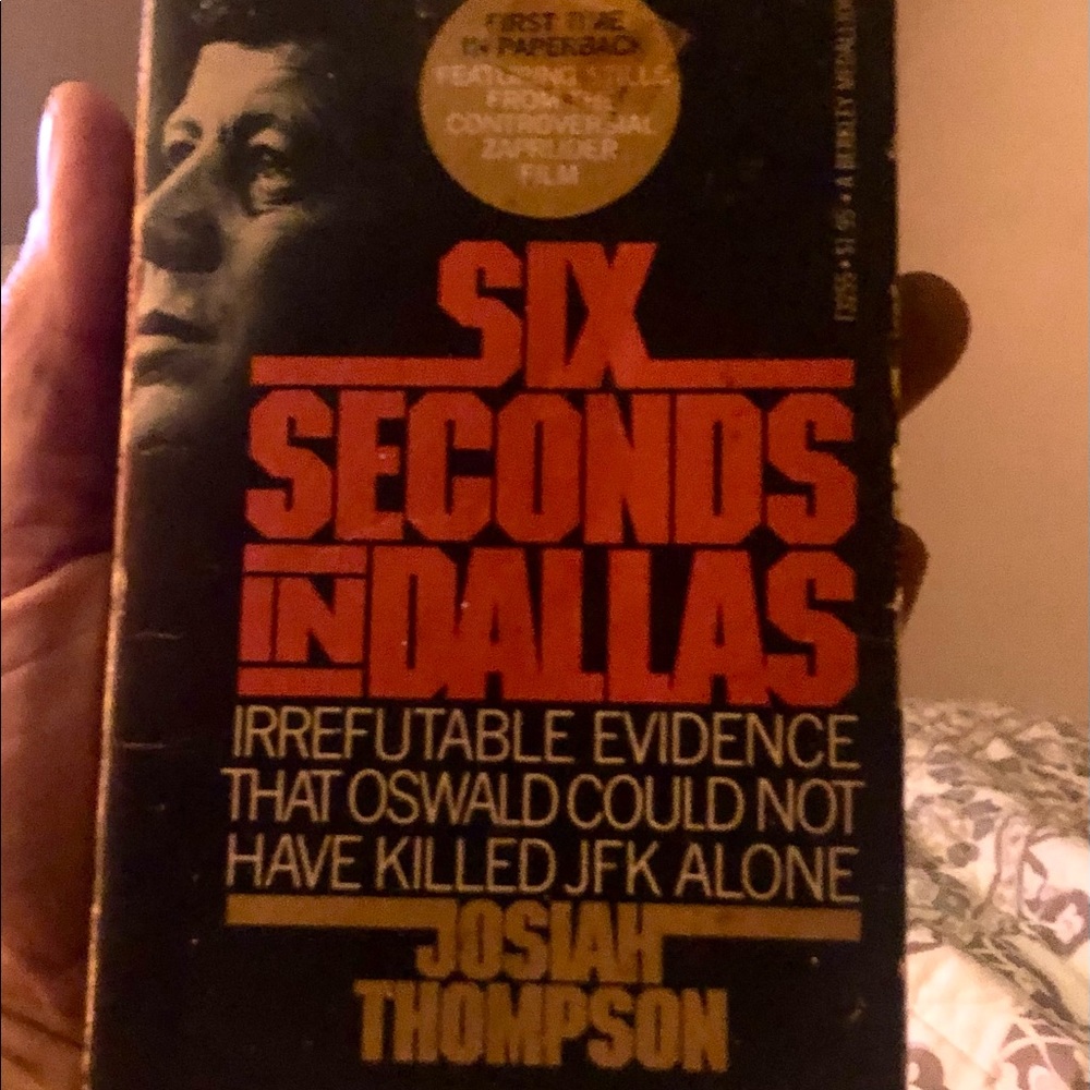the paperback book, “SIX SECONDS IN DALLAS” by JOSIAH THOMPSON.